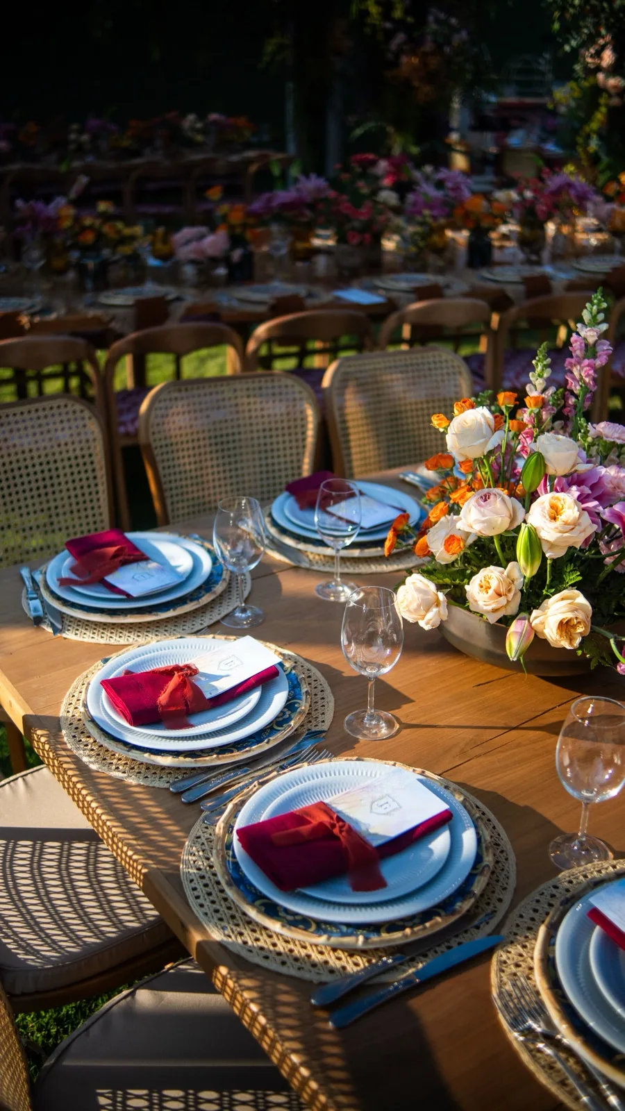 Elegant outdoor table setting with floral centerpiece