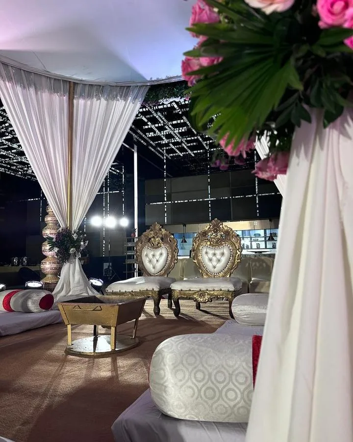 Tented lounge with gold heart-shaped chairs